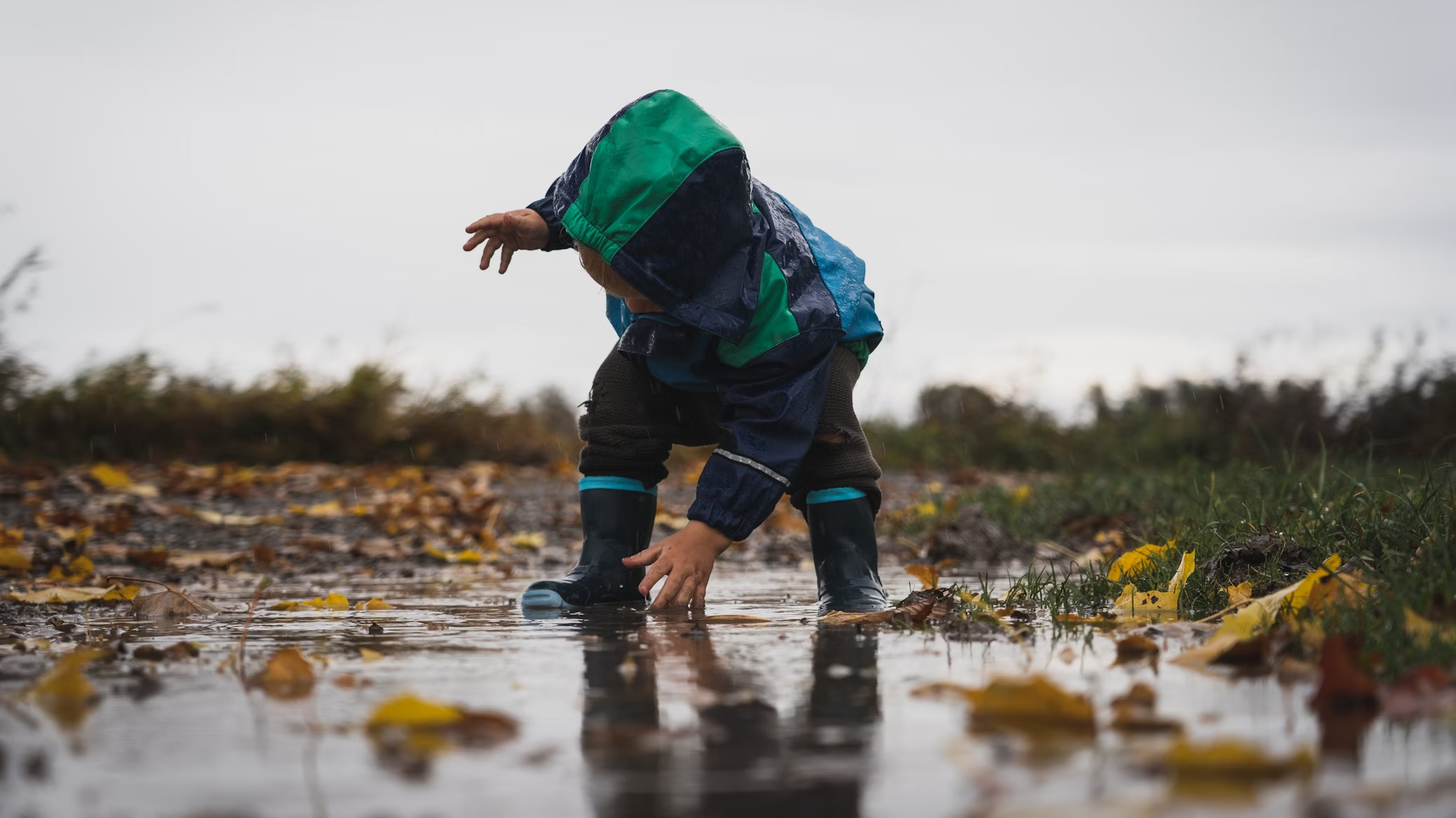 Eco-friendly gardening for kids, water conservation for kids, kid playing in water